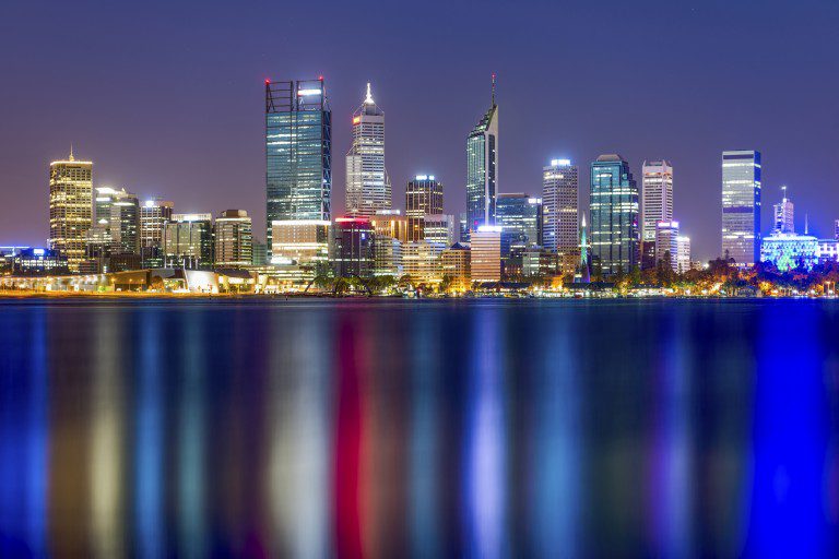 Perth, Western Australia, viewed at night reflected in the Swan River.